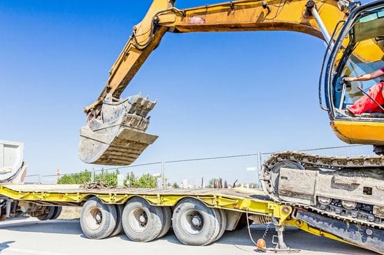 Simplify Your Next Construction Project with a Tilt and Load Truck Rental